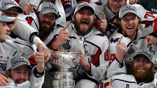 LAS VEGAS, NV - JUNE 07: The Washington Capitals pose for a team photo with the Stanley Cup after defeating the Vegas Golden Knights in Game Five of the Stanley Cup Final during the 2018 NHL Stanley Cup Playoffs at T-Mobile Arena on June 7, 2018 in Las Vegas, Nevada.