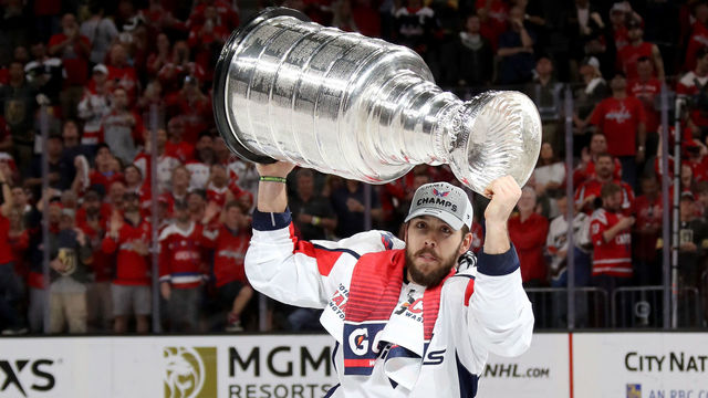 LAS VEGAS, NV - JUNE 07: Chandler Stephenson #18 of the Washington Capitals hoists the Stanley Cup after his team defeated the Vegas Golden Knights 4-3 in Game Five of the 2018 NHL Stanley Cup Final at T-Mobile Arena on June 7, 2018 in Las Vegas, Nevada.