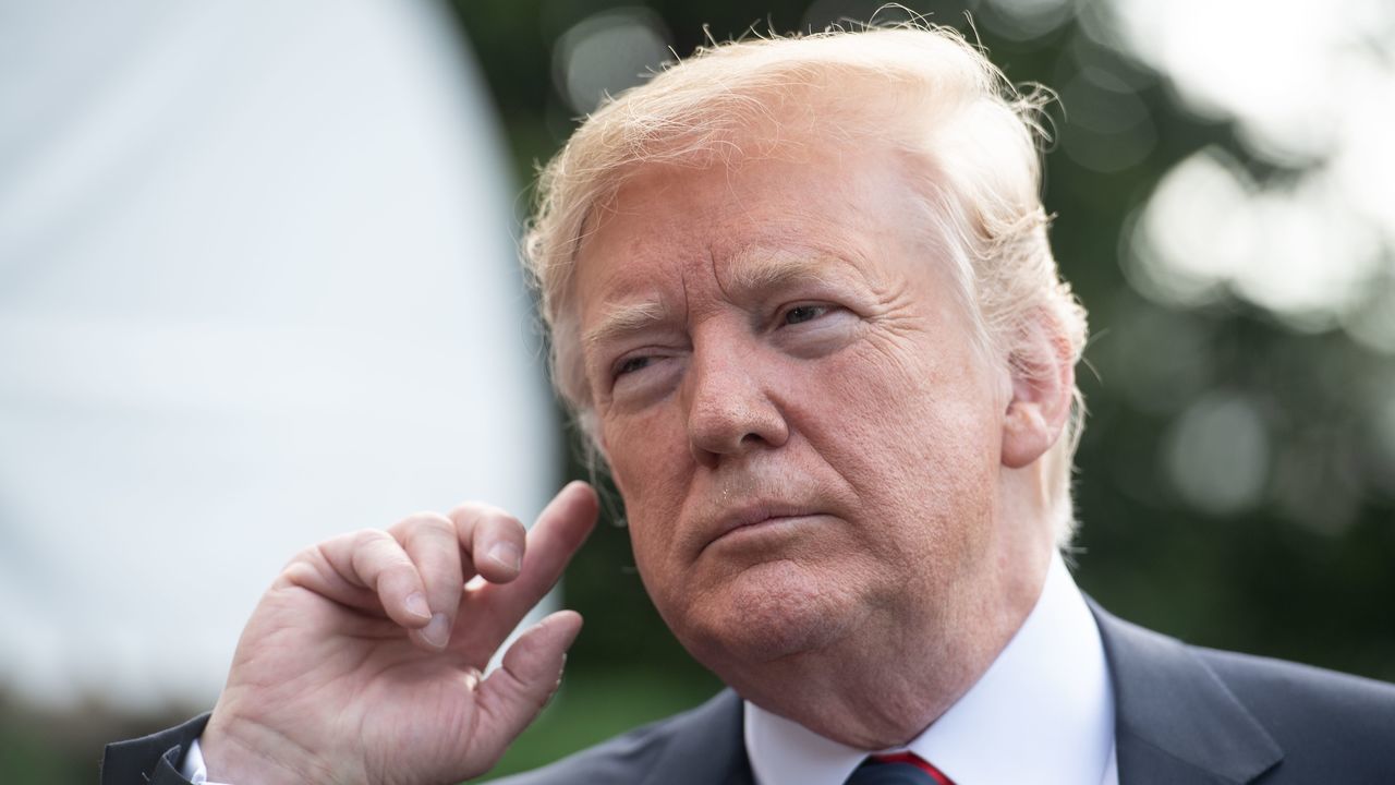 US President Donald Trump listens to a question from the press before departing the White House for the G7 summit in Washington, DC, on June 8, 2018.