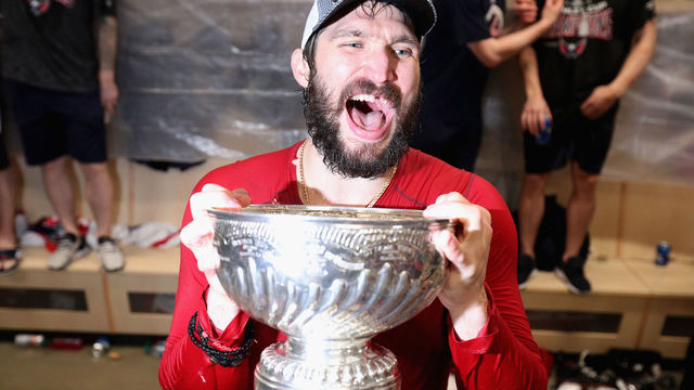 LAS VEGAS, NV - JUNE 07: Alex Ovechkin #8 of the Washington Capitals holds the Stanley Cup in the locker room after the Capitals defeated the Vegas Golden Knights 4-3 in Game Five of the 2018 NHL Stanley Cup Final at T-Mobile Arena on June 7, 2018 in Las Vegas, Nevada. The Capitals won the series four games to one.