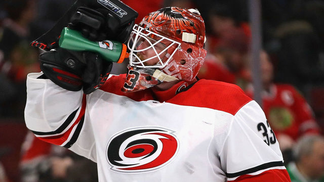 CHICAGO, IL - MARCH 08: Scott Darling #33 of the Carolina Hurricanes takes a drink during a break against the Chicago Blackhawks at the United Center on March 8, 2018 in Chicago, Illinois. The Hurricanes defeated the Blackhawks 3-2.