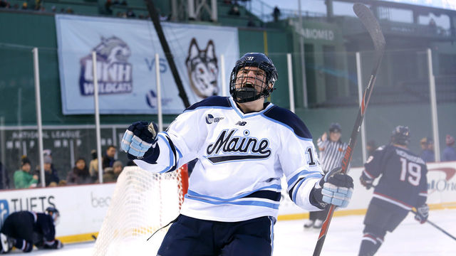 BOSTON, MA - JANUARY 13: Maine vs UCONN hockey game at Fenway Park. Nolan Vesey of Maine celebrates after scoring on an empty net in the third period.