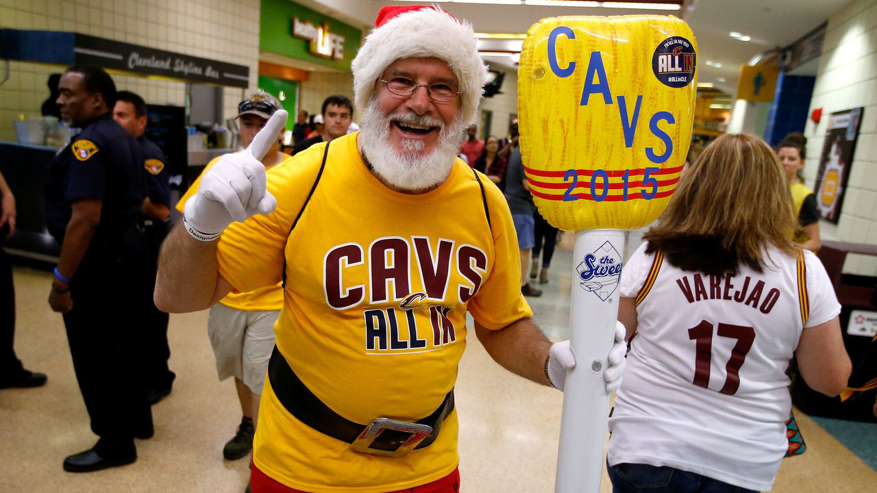 CLEVELAND, OH - MAY 26: A Cleveland Cavaliers fan dressed as Santa Claus holds an inflatable broom before Game Four of the Eastern Conference Finals against the Atlanta Hawks of the 2015 NBA Playoffs at Quicken Loans Arena on May 26, 2015 in Cleveland, Ohio.