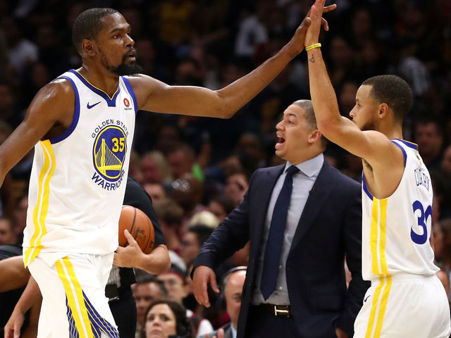 CLEVELAND, OH - JUNE 08: Kevin Durant #35 and Stephen Curry #30 of the Golden State Warriors react as Tyronn Lue of the Cleveland Cavaliers looks on in the first half during Game Four of the 2018 NBA Finals at Quicken Loans Arena on June 8, 2018 in Cleveland, Ohio.