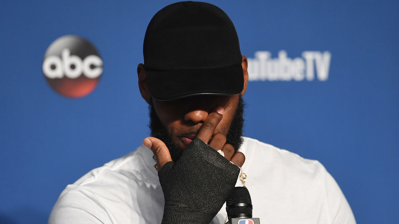 CLEVELAND, OH - JUNE 08: LeBron James #23 of the Cleveland Cavaliers speaks to the media with a cast on his right hand after being defeated by the Golden State Warriors during Game Four of the 2018 NBA Finals at Quicken Loans Arena on June 8, 2018 in Cleveland, Ohio. The Warriors defeated the Cavaliers 108-85 to win the 2018 NBA Finals.