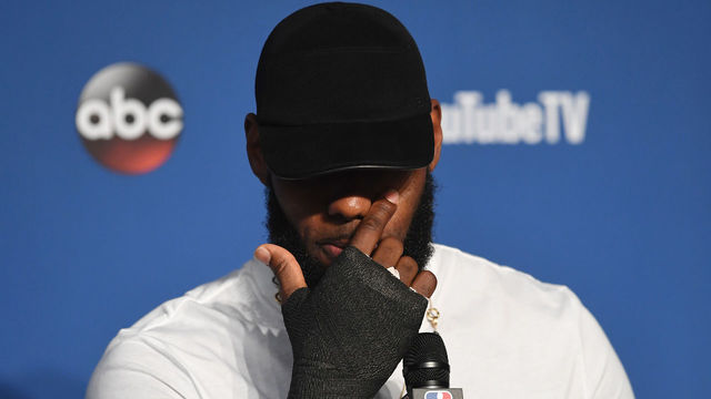 CLEVELAND, OH - JUNE 08: LeBron James #23 of the Cleveland Cavaliers speaks to the media with a cast on his right hand after being defeated by the Golden State Warriors during Game Four of the 2018 NBA Finals at Quicken Loans Arena on June 8, 2018 in Cleveland, Ohio. The Warriors defeated the Cavaliers 108-85 to win the 2018 NBA Finals.