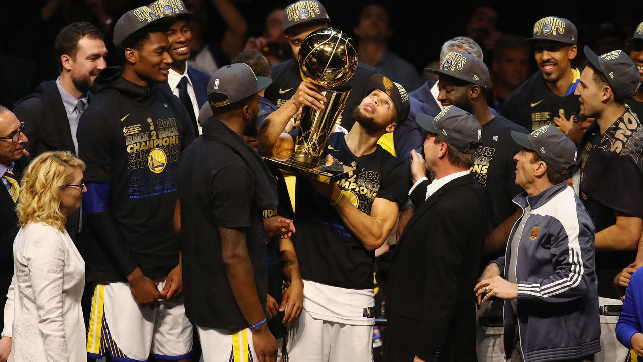 CLEVELAND, OH - JUNE 08: Stephen Curry #30 of the Golden State Warriors celebrates with the Larry O'Brien Trophy after defeating the Cleveland Cavaliers during Game Four of the 2018 NBA Finals at Quicken Loans Arena on June 8, 2018 in Cleveland, Ohio. The Warriors defeated the Cavaliers 108-85 to win the 2018 NBA Finals.