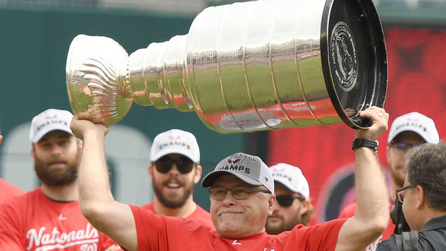 WASHINGTON, DC - JUNE 09: Head coach Barry Trotz of the Washington Capitals raises the Stanley Cup as the team is honored before a baseball game between the Washington Nationals and the San Francisco Giants at Nationals Park on June 9, 2018 in Washington, DC.