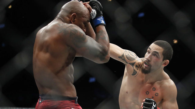 Whittaker defeats Romero by split decision in Fight of the Year candidate
