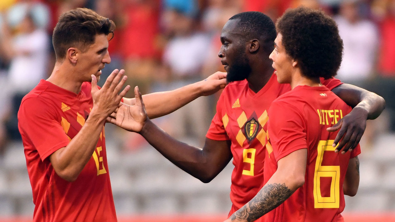Belgium's forward Romelu Lukaku (C) celebrates with teammates Belgium's defender Thomas Meunier (L) and Belgium's midfielder Axel Witsel (R) after scoring a goal during the international friendly football match between Belgium and Egypt at the King Baudouin Stadium, in Brussels, on June 6, 2018.