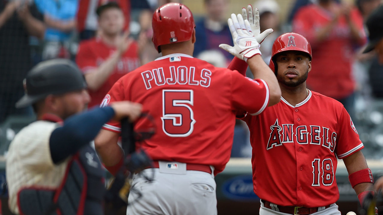 MINNEAPOLIS, MN - JUNE 09: Luis Valbuena #18 of the Los Angeles Angels of Anaheim congratulates teammate Albert Pujols #5 on a solo home run as Bobby Wilson #46 of the Minnesota Twins looks on during the sixth inning of the game on June 9, 2018 at Target Field in Minneapolis, Minnesota. The Angels defeated the Twins 2-1.