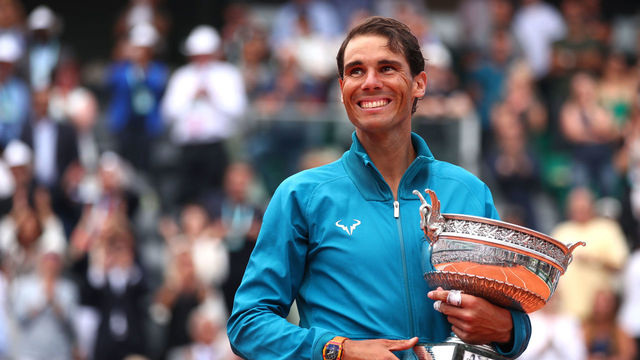 PARIS, FRANCE - JUNE 10: Rafael Nadal of Spain hugs the Musketeers' Cup as he celebrates victory following the mens singles final against Dominic Thiem of Austria during day fifteen of the 2018 French Open at Roland Garros on June 10, 2018 in Paris, France.