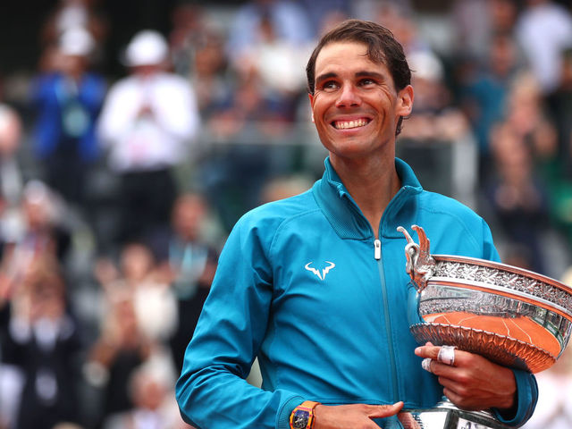PARIS, FRANCE - JUNE 10: Rafael Nadal of Spain hugs the Musketeers' Cup as he celebrates victory following the mens singles final against Dominic Thiem of Austria during day fifteen of the 2018 French Open at Roland Garros on June 10, 2018 in Paris, France.