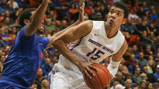 BOISE, ID - NOVEMBER 30: Guard Chandler Hutchison #15 of the Boise State Broncos drives into the key followed by guard Sterling Brown #3 of the SMU Mustangs during second half action on November 30, 2016 at Taco Bell Arena in Boise, Idaho. Boise State won the game 71-62.