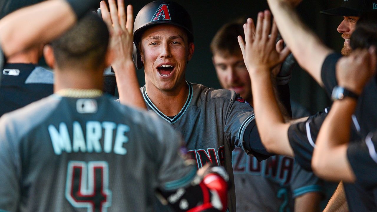 DENVER, CO - JUNE 8: Jake Lamb #22 of the Arizona Diamondbacks celebrates in the dugout after hitting a third inning homerun against the Colorado Rockies at Coors Field on June 8, 2018 in Denver, Colorado.