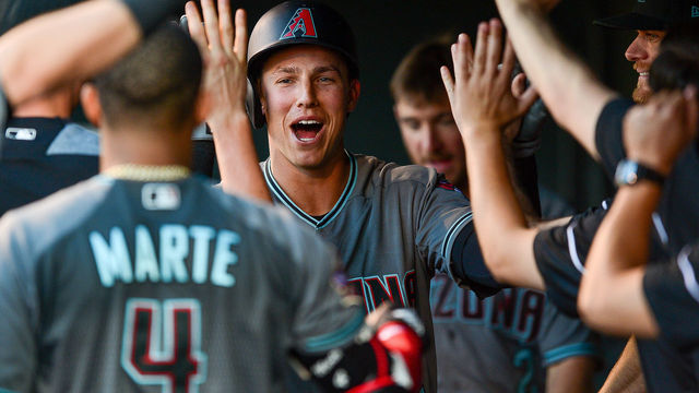 DENVER, CO - JUNE 8: Jake Lamb #22 of the Arizona Diamondbacks celebrates in the dugout after hitting a third inning homerun against the Colorado Rockies at Coors Field on June 8, 2018 in Denver, Colorado.