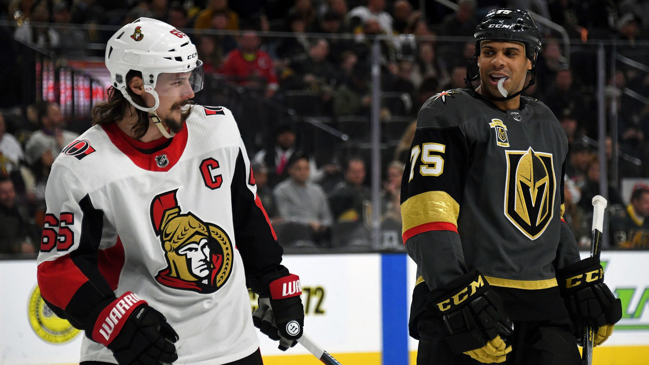 LAS VEGAS, NV - MARCH 02: Erik Karlsson #65 of the Ottawa Senators and Ryan Reaves #75 of the Vegas Golden Knights talk while waiting for a faceoff in the second period of their game at T-Mobile Arena on March 2, 2018 in Las Vegas, Nevada. The Senators won 5-4.