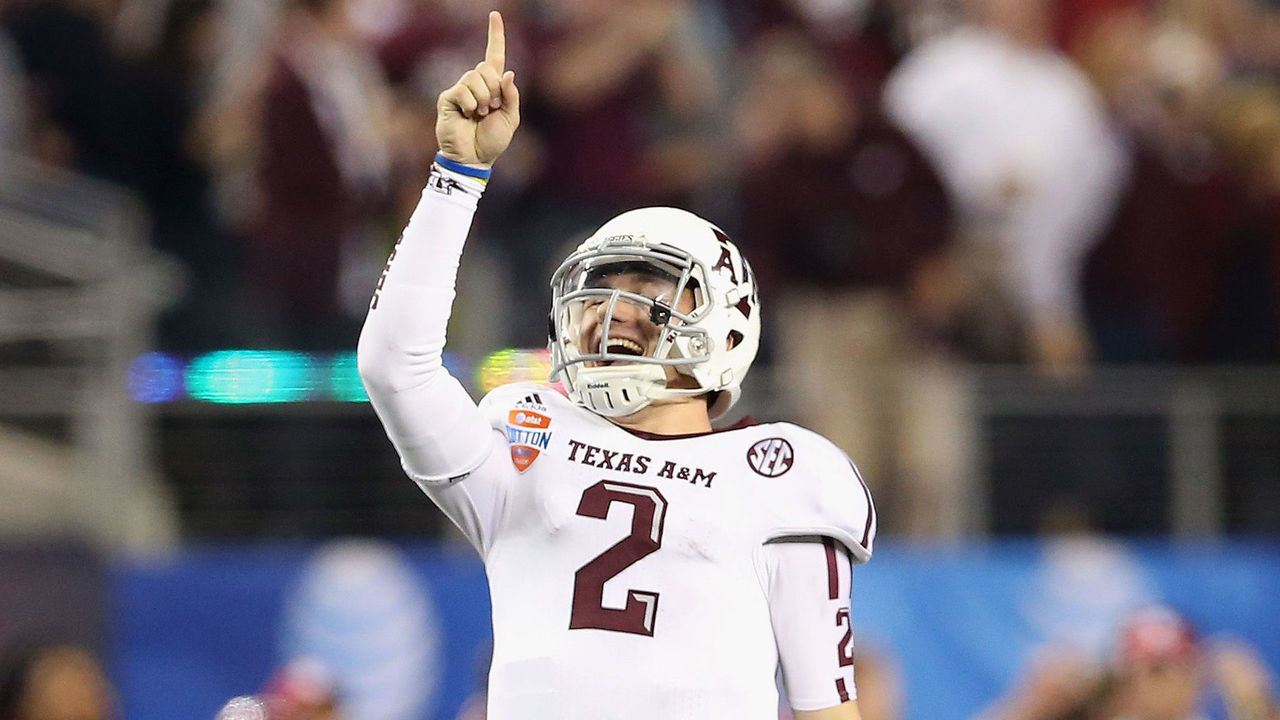 ARLINGTON, TX - JANUARY 04: Johnny Manziel #2 of the Texas A&M Aggies celebrates a touchdown against the Oklahoma Sooners during the Cotton Bowl at Cowboys Stadium on January 4, 2013 in Arlington, Texas.