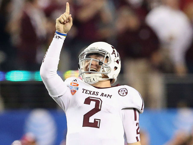 ARLINGTON, TX - JANUARY 04: Johnny Manziel #2 of the Texas A&M Aggies celebrates a touchdown against the Oklahoma Sooners during the Cotton Bowl at Cowboys Stadium on January 4, 2013 in Arlington, Texas.