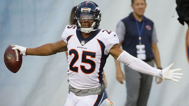 CHICAGO, IL - AUGUST 10: Chris Harris #25 of the Denver Broncos celebrates after returning an interception for a touchdown against the Chicago Bears during a preseason game at Soldier Field on August 10, 2017 in Chicago, Illinois.