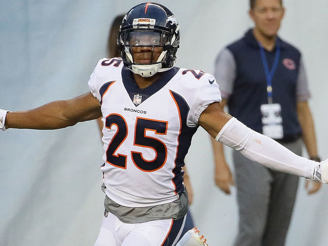 CHICAGO, IL - AUGUST 10: Chris Harris #25 of the Denver Broncos celebrates after returning an interception for a touchdown against the Chicago Bears during a preseason game at Soldier Field on August 10, 2017 in Chicago, Illinois.