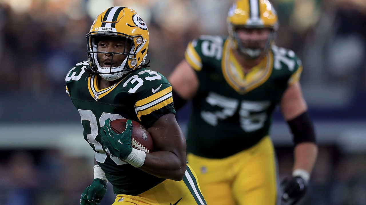 ARLINGTON, TX - OCTOBER 08: Aaron Jones #33 of the Green Bay Packers runs the ball against the Dallas Cowboys in the fourth quarter at AT&T Stadium on October 8, 2017 in Arlington, Texas.