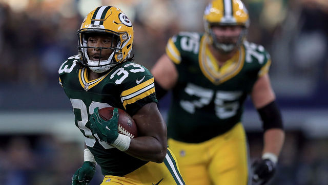 ARLINGTON, TX - OCTOBER 08: Aaron Jones #33 of the Green Bay Packers runs the ball against the Dallas Cowboys in the fourth quarter at AT&T Stadium on October 8, 2017 in Arlington, Texas.