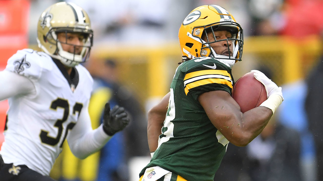 GREEN BAY, WI - OCTOBER 22: Aaron Jones #33 of the Green Bay Packers rushes for a touchdown against the New Orleans Saints during the first quarter at Lambeau Field on October 22, 2017 in Green Bay, Wisconsin.