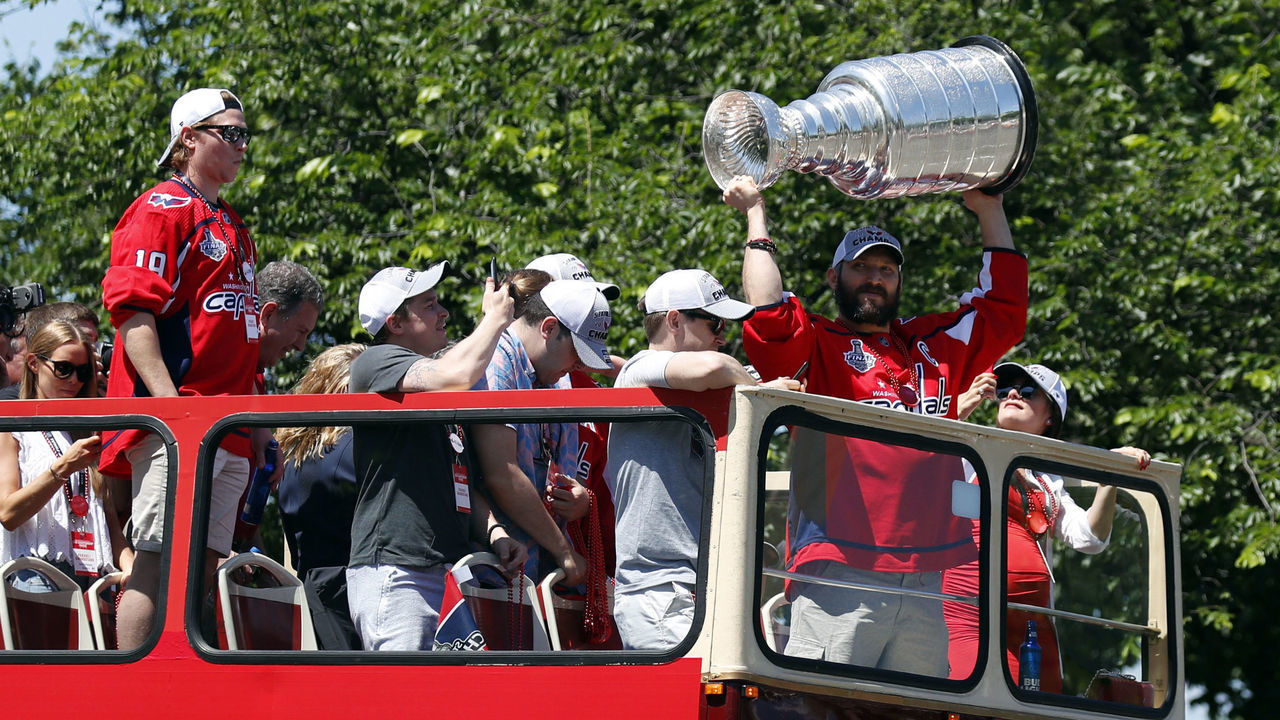 WASHINGTON, DC - JUNE 12: Alex Ovechkin of the NHL champions Washington Capitals holds up the Stanley Cup during a victory parade along Contitution Avenue June 12, 2018, in Washington, DC.