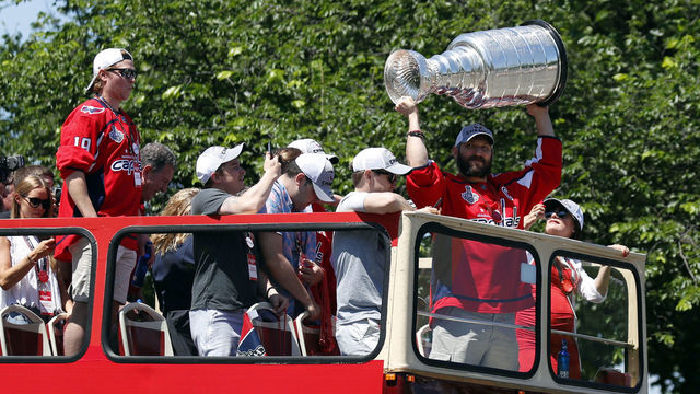 WASHINGTON, DC - JUNE 12: Alex Ovechkin of the NHL champions Washington Capitals holds up the Stanley Cup during a victory parade along Contitution Avenue June 12, 2018, in Washington, DC.