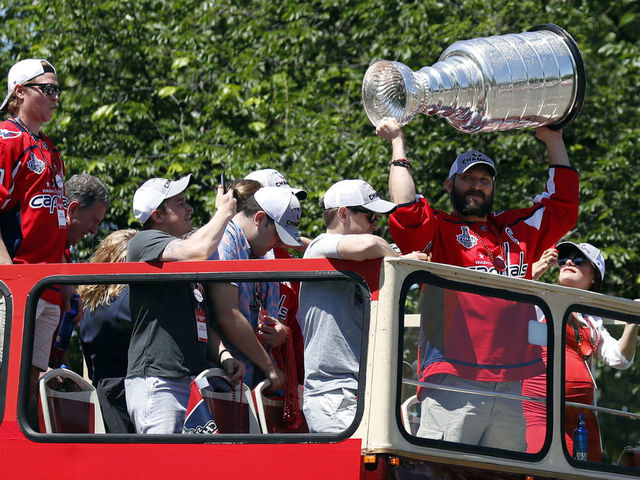 WASHINGTON, DC - JUNE 12: Alex Ovechkin of the NHL champions Washington Capitals holds up the Stanley Cup during a victory parade along Contitution Avenue June 12, 2018, in Washington, DC.