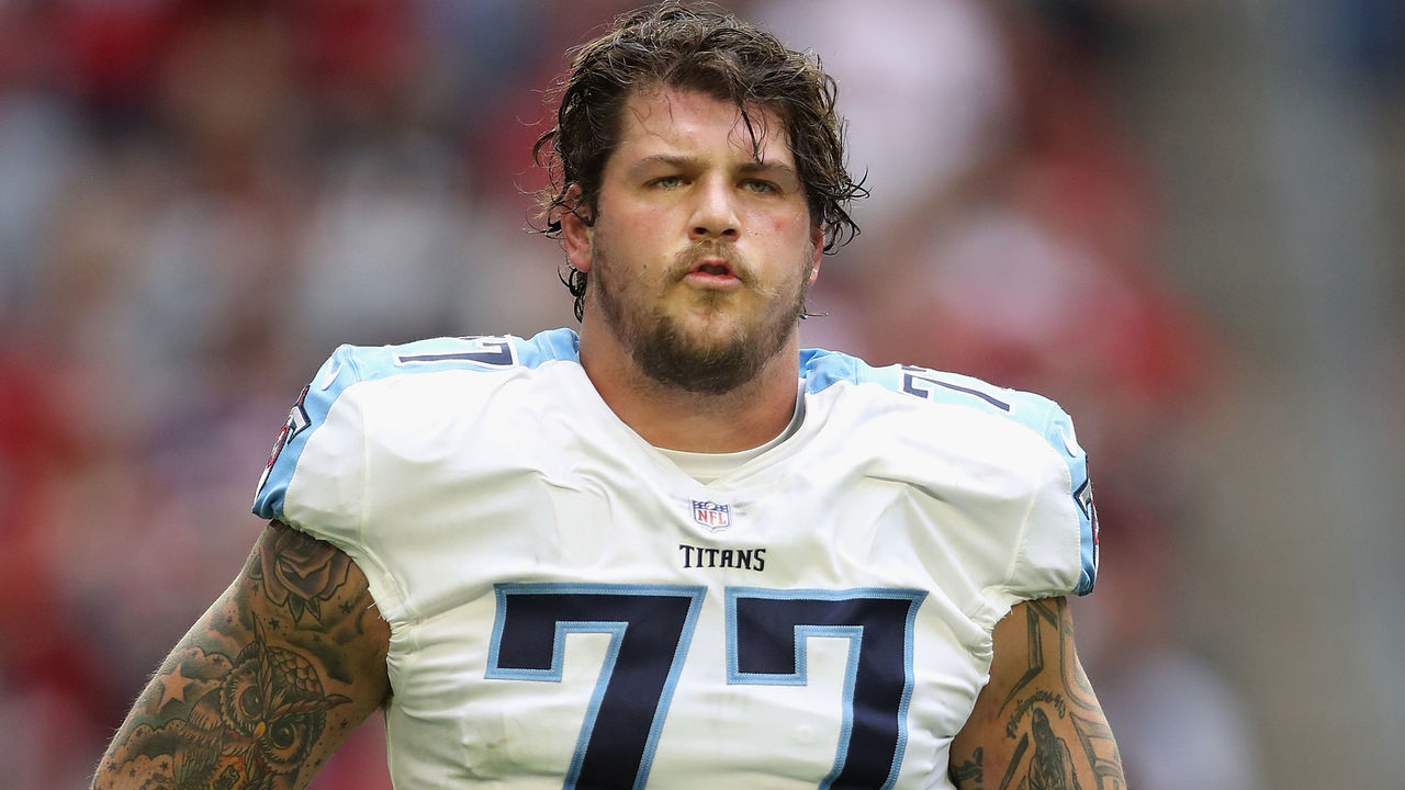 GLENDALE, AZ - DECEMBER 10: Offensive tackle Taylor Lewan #77 of the Tennessee Titans walks on the field during the first half of the NFL game against the Arizona Cardinals at the University of Phoenix Stadium on December 10, 2017 in Glendale, Arizona. The Cardinals defeated the Titans 12-7.