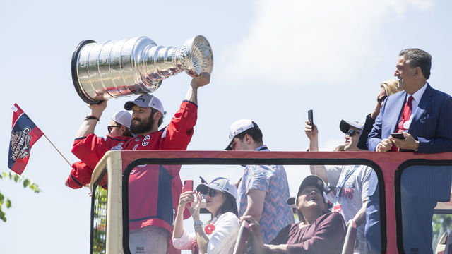 WASHINGTON, DC - JUNE 12: Alex Ovechkin of the NHL champion Washington Capitals hoists the Stanley Cup during a parade down Constitution Avenue on June 12, 2018 in Washington, DC.