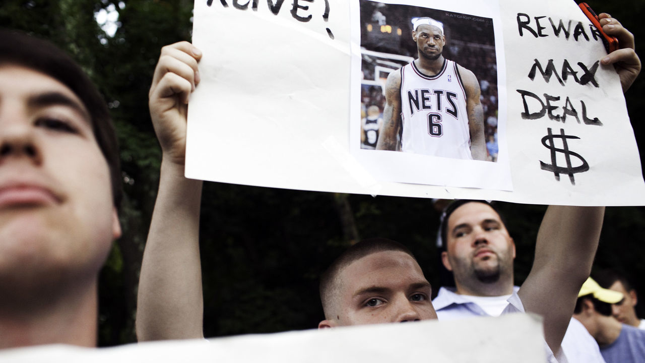 GREENWICH, CT - JULY 8: Tom Martel, 19, of Southington, Connecticut stands in a large crowd of fans assembled outside the Boys & Girls Club of Greenwich hours before LeBron James was to arrive July 8, 2010 in Greenwich, Connecticut. Free agent NBA player LeBron James announced live on ESPN from the Boys & Girls Club of Greenwich that he will be playing for the Miami Heat this coming season.