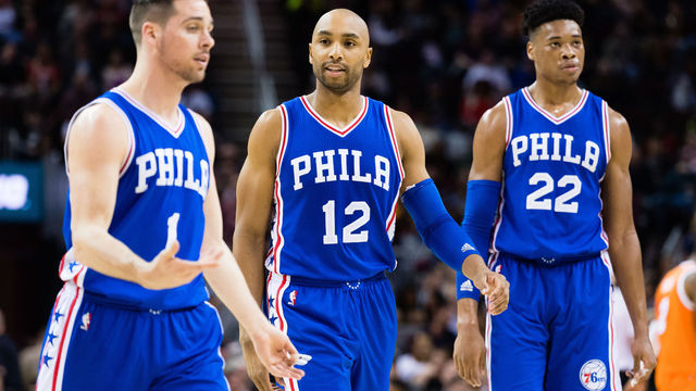CLEVELAND, OH - MARCH 31: T.J. McConnell #1 talks with Gerald Henderson #12 and Richaun Holmes #22 of the Philadelphia 76ers as they walk off the court during the first half against the Cleveland Cavaliers at Quicken Loans Arena on March 31, 2017 in Cleveland, Ohio. NOTE TO USER: User expressly acknowledges and agrees that, by downloading and/or using this photograph, user is consenting to the terms and conditions of the Getty Images License Agreement.