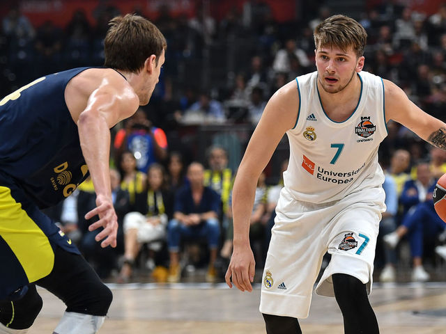 Fenerbahce's Czech center Jan Vesely (L) fights for the ball against Real Madrid's Slovenian Luka Doncic during the Euroleague Final Four finals basketball match between Real Madrid and Fenerbahce Dogus Istanbul at The Stark Arena in Belgrade on May 20, 2018.