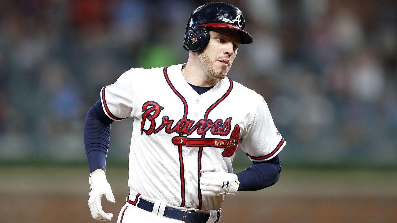 ATLANTA, GA - JUNE 12: First baseman Freddie Freeman #5 of the Atlanta Braves runs the bases after hitting a home run in the sixth inning during the game against the New York Mets at SunTrust Park on June 12, 2018 in Atlanta, Georgia.