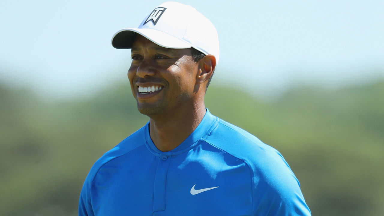 SOUTHAMPTON, NY - JUNE 12: Tiger Woods of the United States smiles on the eighth green during a practice round prior to the 2018 U.S. Open at Shinnecock Hills Golf Club on June 12, 2018 in Southampton, New York.