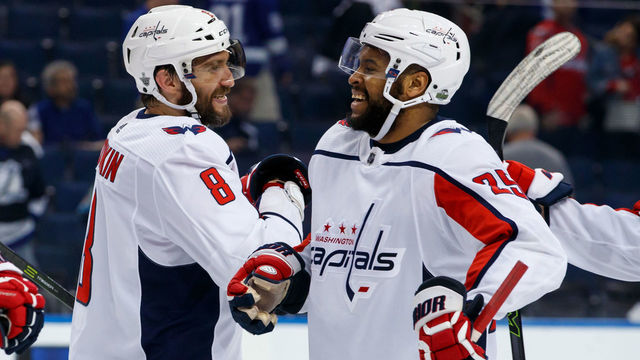 TAMPA, FL - MAY 13: Alex Ovechkin #8 and Devante Smith-Pelly #25 of the Washington Capitals celebrate the win against the Tampa Bay Lightning after Game Two of the Eastern Conference Final during the 2018 NHL Stanley Cup Playoffs at Amalie Arena on May 13, 2018 in Tampa, Florida.