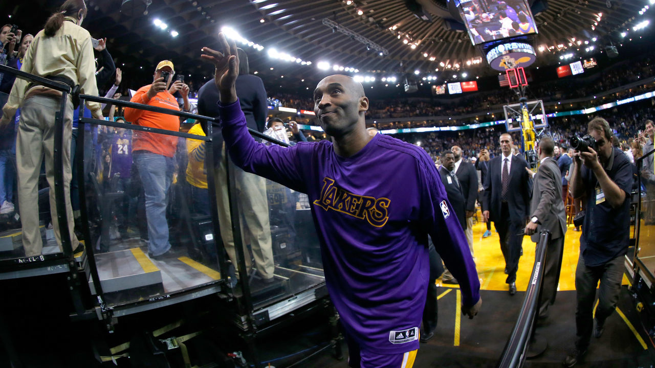 OAKLAND, CA - JANUARY 14: Kobe Bryant #24 of the Los Angeles Lakers waves to the crowd after their game against the Golden State Warriors at ORACLE Arena on January 14, 2016 in Oakland, California.