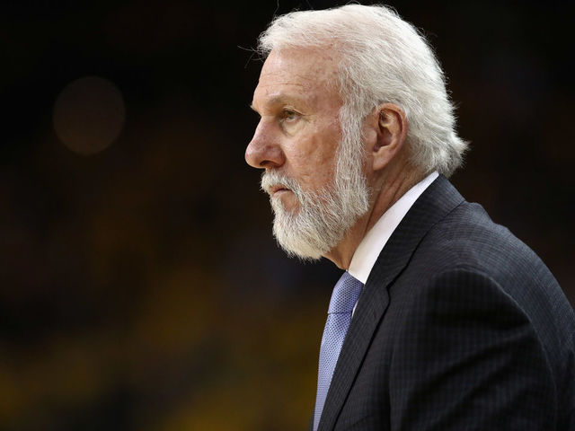 OAKLAND, CA - APRIL 16: Head coach Gregg Popovich of the San Antonio Spurs stands on the side of the court during their game against the Golden State Warriors during Game 2 of Round 1 of the 2018 NBA Playoffs at ORACLE Arena on April 16, 2018 in Oakland, California.