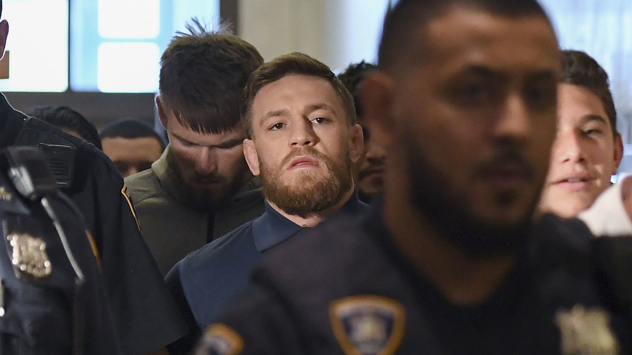 Irish Mixed Martial Arts fighter Conor McGregor leaves the Kings County (Brooklyn) Criminal Court on April 6, 2018 in New York. Irish Mixed Martial Arts fighter Conor McGregor was charged with assault and criminal mischief by New York police on April 6, 2018 and was due to appear in court. The 29-year-old superstar reportedly surrendered at a Brooklyn police station late Thursday after allegedly attacking a shuttle bus loaded with fellow mixed martial arts fighters attending a New York media event at the Barclays Center stadium.Video footage showed McGregor hurling a dolly through a side window of the bus as it moved slowly in a parking lot at the stadium in Brooklyn. / AFP PHOTO / ANGELA WEISS