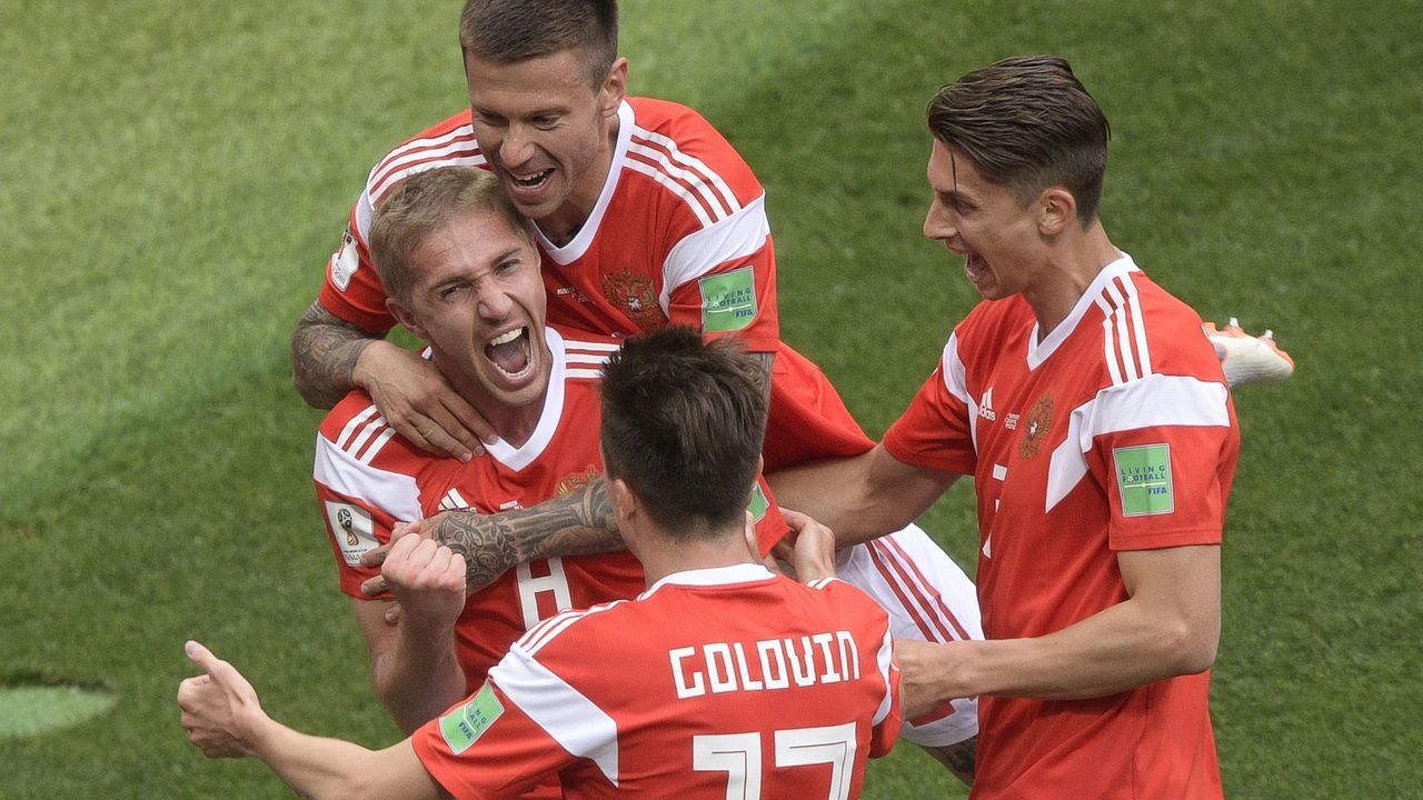 Russia's midfielder Yuri Gazinskiy (centre L) celebrates his goal with teammates during the Russia 2018 World Cup Group A football match between Russia and Saudi Arabia at the Luzhniki Stadium in Moscow on June 14, 2018.