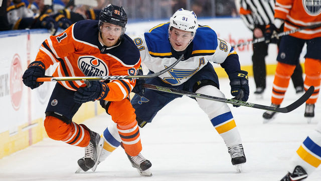 EDMONTON, AB - DECEMBER 21: Drake Caggiula #91 of the Edmonton Oilers is chased by Vladimir Tarasenko #91 of the St. Louis Blues at Rogers Place on December 21, 2017 in Edmonton, Canada.