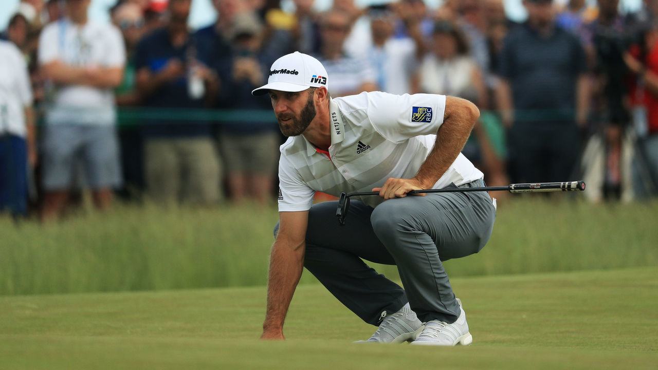 SOUTHAMPTON, NY - JUNE 14: Dustin Johnson of the United States lines up a putt on the 13th green during the first round of the 2018 U.S. Open at Shinnecock Hills Golf Club on June 14, 2018 in Southampton, New York.