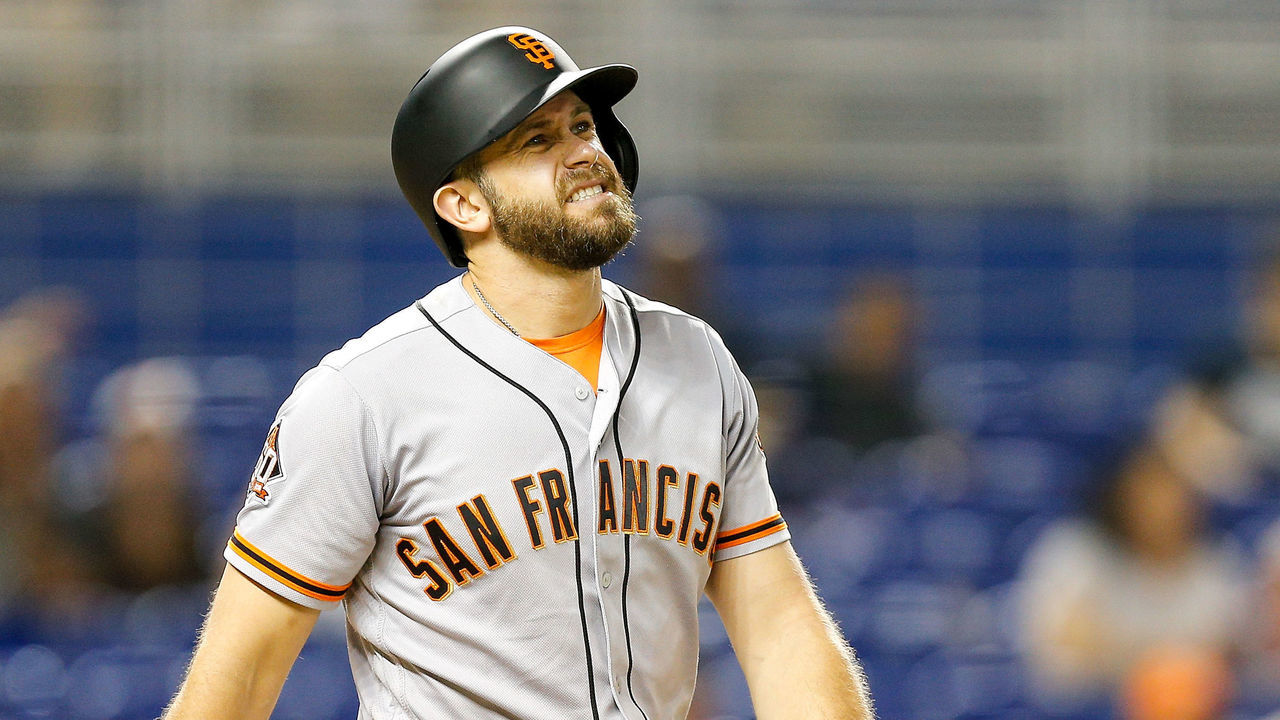MIAMI, FL - JUNE 14: Evan Longoria #10 of the San Francisco Giants reacts after being hit by a pitch in the third inning against the Miami Marlins at Marlins Park on June 14, 2018 in Miami, Florida.