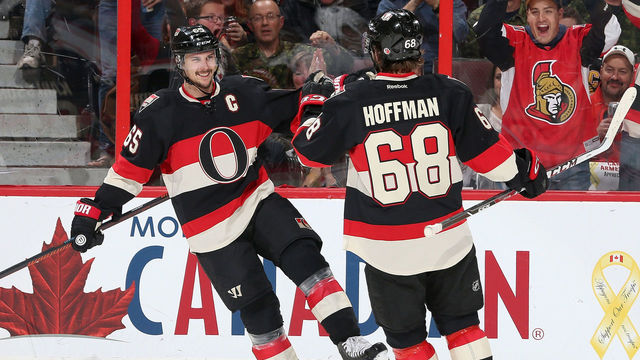 OTTAWA, ON - NOVEMBER 12: Erik Karlsson #65 of the Ottawa Senators celebrates his second period goal with team mate Mike Hoffman #68 against the Vancouver Canucks during an NHL game at Canadian Tire Centre on November 12, 2015 in Ottawa, Ontario, Canada.