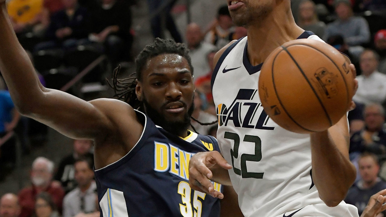 SALT LAKE CITY, UT - OCTOBER 18: Thabo Sefolosha #22 of the Utah Jazz looks to pass the ball while being defended by Kenneth Faried #35 of the Denver Nuggets in the first half at Vivint Smart Home Arena on October 18, 2017 in Salt Lake City, Utah.