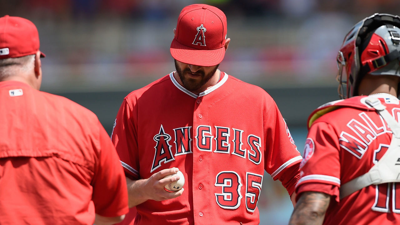 MINNEAPOLIS, MN - JUNE 10: Manager Mike Scioscia #14 of the Los Angeles Angels of Anaheim walks out to the mound to pull Nick Tropeano #35 as Martin Maldonado #12 looks on during the fifth inning of the game against the Minnesota Twins on June 10, 2018 at Target Field in Minneapolis, Minnesota. The Twins defeated the Angels 7-5.
