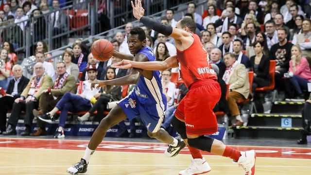 MUNICH, GERMANY - FEBRUARY 04: Isaac Bonga of Fraport Skyliners and Alex King of FC Bayern Muenchen battle for the ball during the game between FC Bayern Muenchen and the Fraport Skyliners at Audi Dome on February 4, 2017 in Munich, Germany.